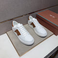 White and Brown Low-Top Sneakers